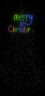 Vibrant neon Christmas text with stars on black background.