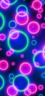 Colorful neon circle wallpaper with vibrant glowing rings.