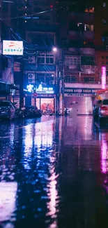 Neon-lit city street with reflections on a wet surface at night.