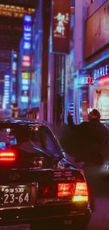 Neon-lit city street at night with car and pedestrians.