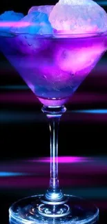 A neon cocktail glass with glowing ice cubes on a dark background.