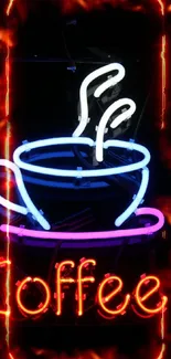 Neon sign of a steaming coffee cup against a black background.