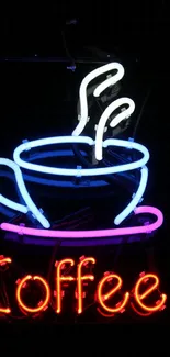 Neon sign of coffee cup with steam in vibrant colors on black background.