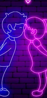 Neon art of a couple kissing on a brick wall.