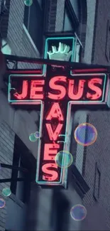 Neon cross sign reading 'Jesus Saves' with bubbles on a city wall.