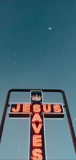 Neon cross with 'Jesus Saves' against a sky background.