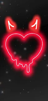 Neon devil heart glowing wallpaper with red heart and horns on black background.