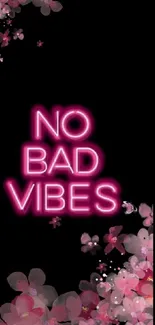 No Bad Vibes neon wallpaper with pink floral accents.