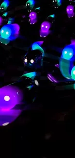 Neon glowing creatures in purple and turquoise on dark background.