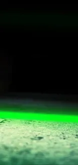 Neon green glow illuminating a dark corridor in wallpaper.