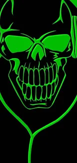 Neon green skull with headphones on black wallpaper.