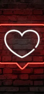 Neon heart glowing on a brick wall background.