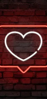 Red neon heart on a brick wall background.