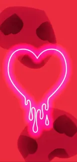 Neon pink heart dripping on black background.