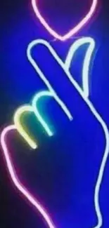 Neon hand gesture with heart design on blue background.