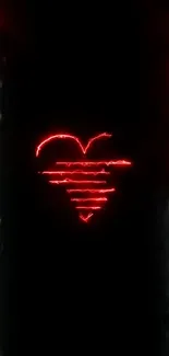 Neon heart glowing with red light on a dark background wallpaper.