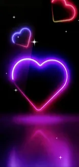 Mobile wallpaper with glowing neon hearts on a black background.