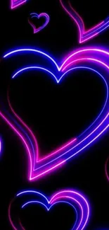 Bright neon heart designs on a black background.