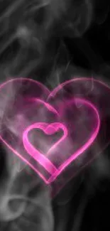 Neon pink heart glowing on black background wallpaper.