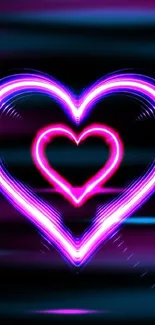 Vibrant neon heart with pink and purple glow on a dark background.