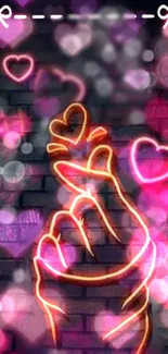 Neon hand gesture with heart shapes wallpaper.