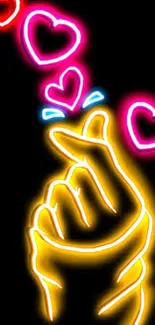 Neon hand gesture with glowing hearts on black.