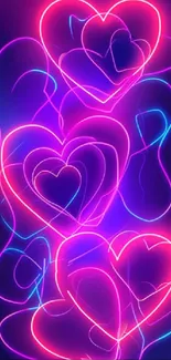 Neon heart pattern wallpaper with pink and blue hues.