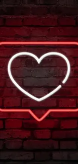 Neon heart glowing against brick wall in vivid red hue.