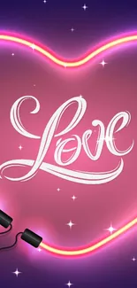 Neon pink heart with 'Love' glowing on a dark blue background.