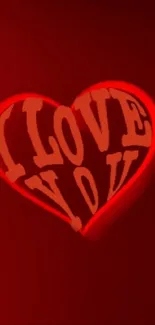 Glowing red neon heart with 'I Love You' text on dark background.