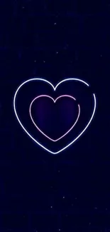 Glowing neon heart on a dark blue brick wall background.