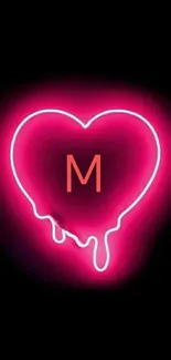 Neon heart with pink glow on black background.