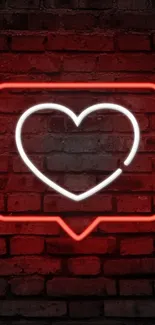 Neon heart with red glow on a rustic brick wall.