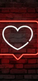 Neon heart glowing on a brick wall background.