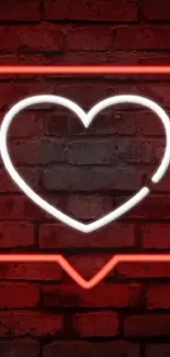 Neon heart glowing on a red brick wall background.