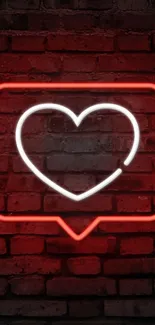 Neon heart symbol on a red brick wall background.