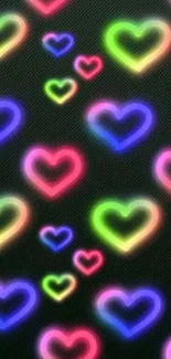 Mobile wallpaper with neon heart pattern on a black background.