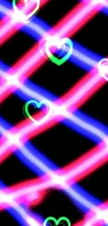 Neon heart pattern on black background wallpaper.