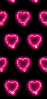 Neon pink hearts pattern on a black background.