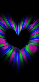 Neon heart design with colorful glowing effect on a black background.