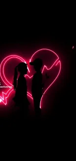 Silhouetted couple with neon pink broken heart.