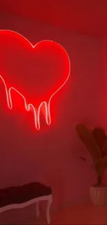 Vibrant red neon heart glows on wall.