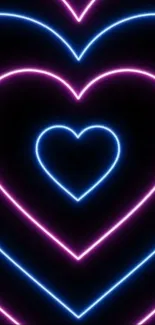 Neon heart wallpaper with vibrant pink and blue glow on a black background.