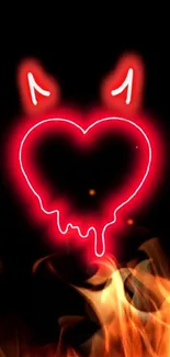 Neon heart with devil horns on black background.