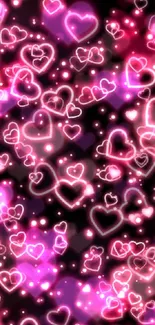 Vibrant neon hearts on a dark background wallpaper.