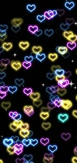 Colorful neon hearts on a black background for mobile wallpaper.