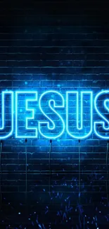 Neon blue Jesus sign on a brick wall background.