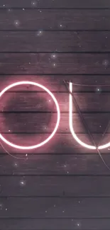 Neon "YOU" letters glowing on dark wood wall.