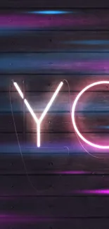 Neon light wallpaper on dark wood background with glowing letters.