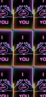 Neon artwork of hands forming a heart with text 'I Love You'.